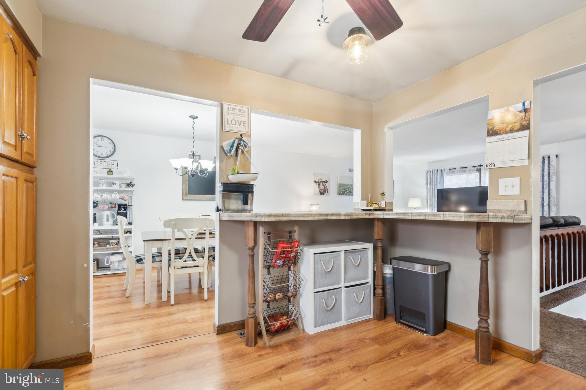 20 Holly Trail Alloway, NJ 08302 - Photo 11 of 26 a kitchen with stainless steel appliances kitchen island granite countertop a refrigerator a stove and a cabinets with wooden floor