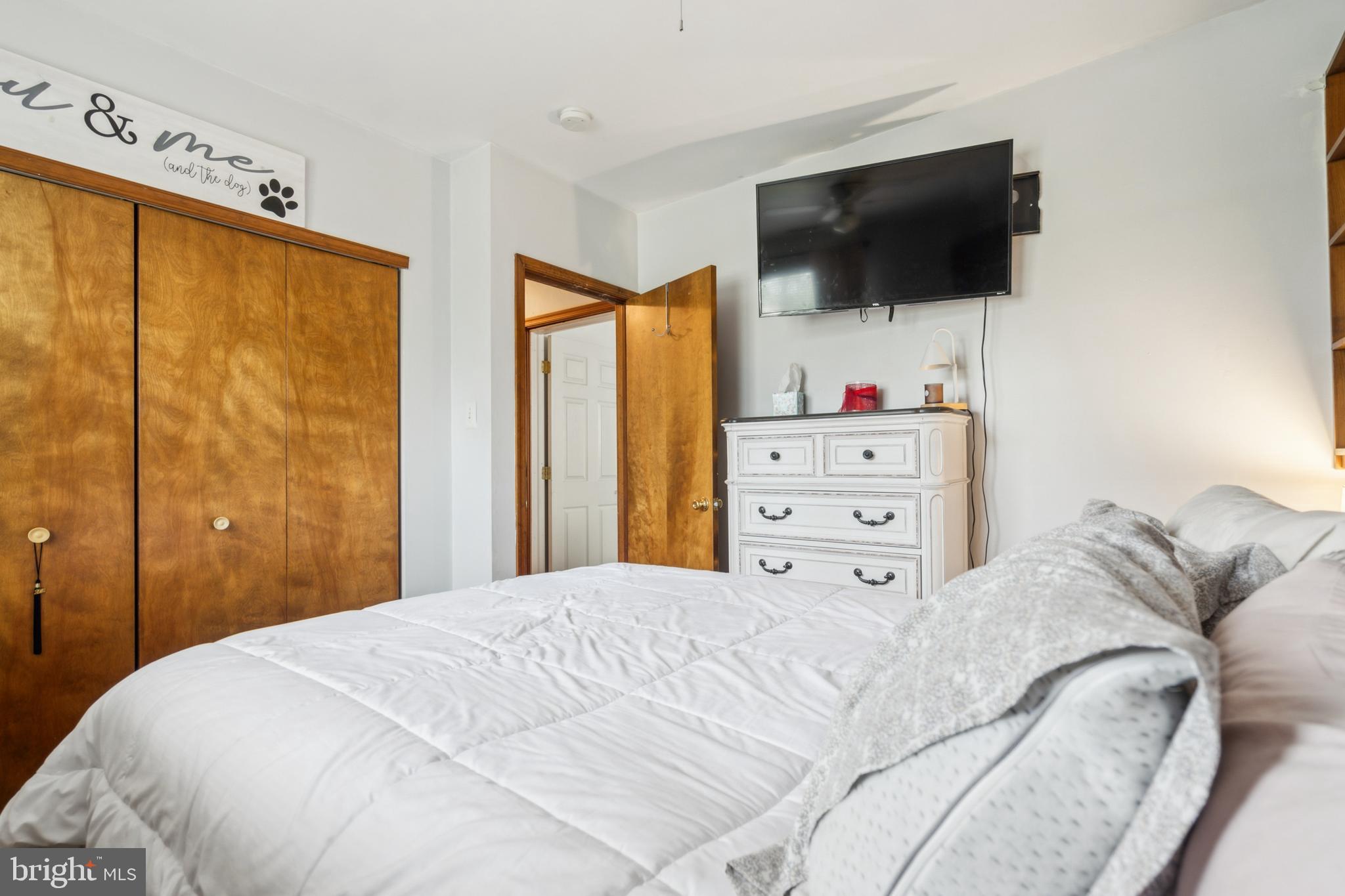 20 Holly Trail Alloway, NJ 08302 - Photo 21 of 26 a bedroom with a large bed and flat screen tv