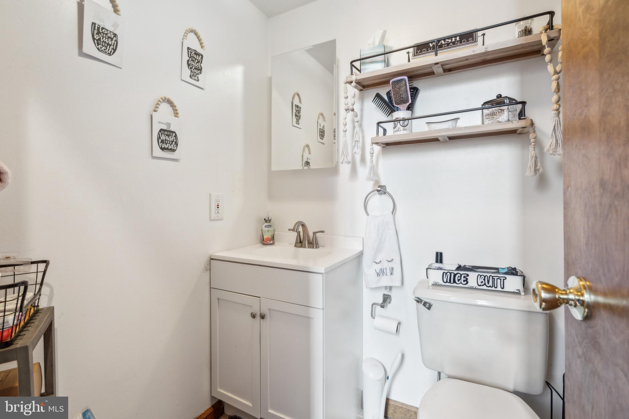 20 Holly Trail Alloway, NJ 08302 - Photo 22 of 26 a bathroom with a sink a toilet and shower