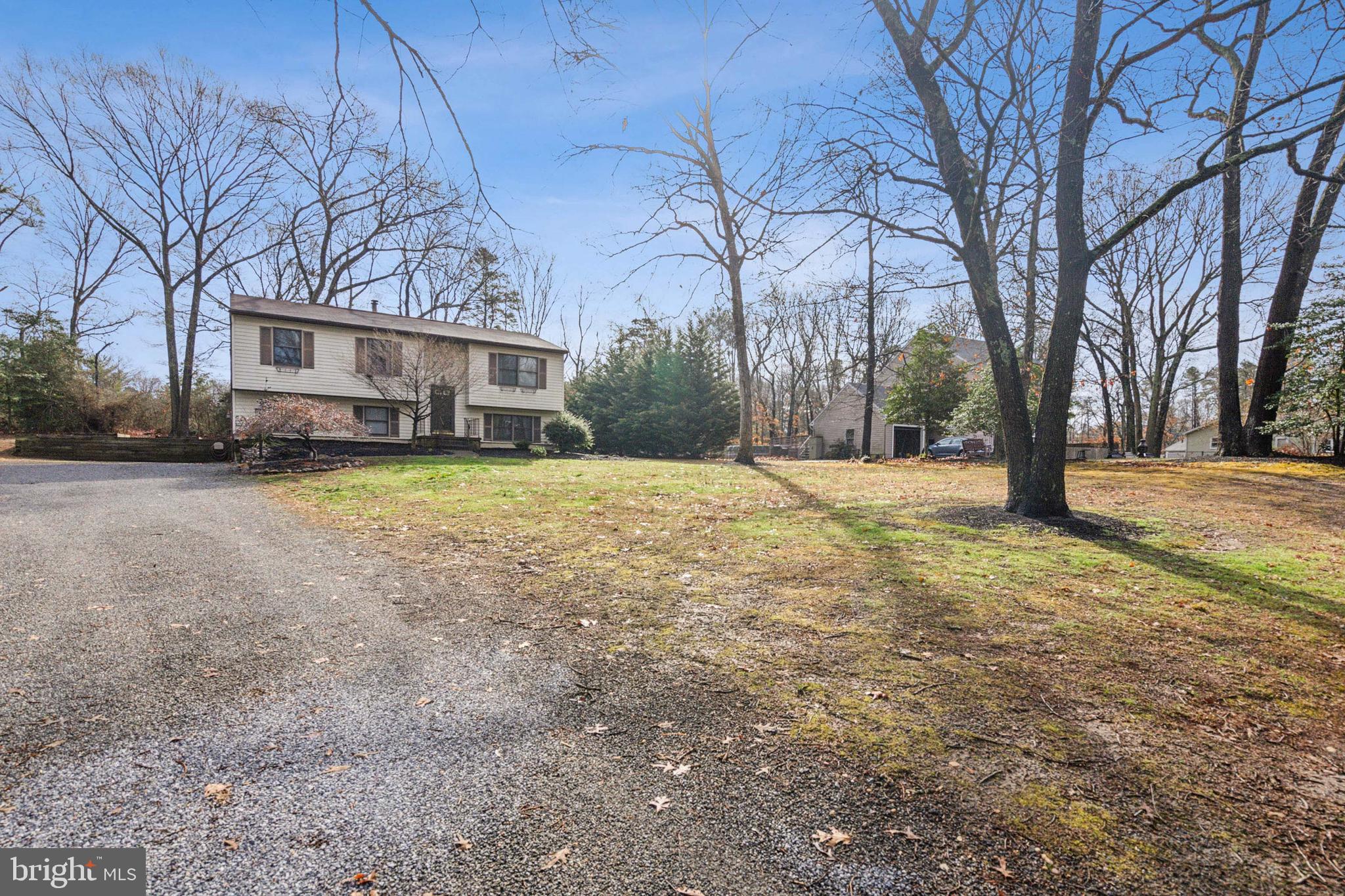 20 Holly Trail Alloway, NJ 08302 - Photo 3 of 26 a view of a house with a yard covered in snow