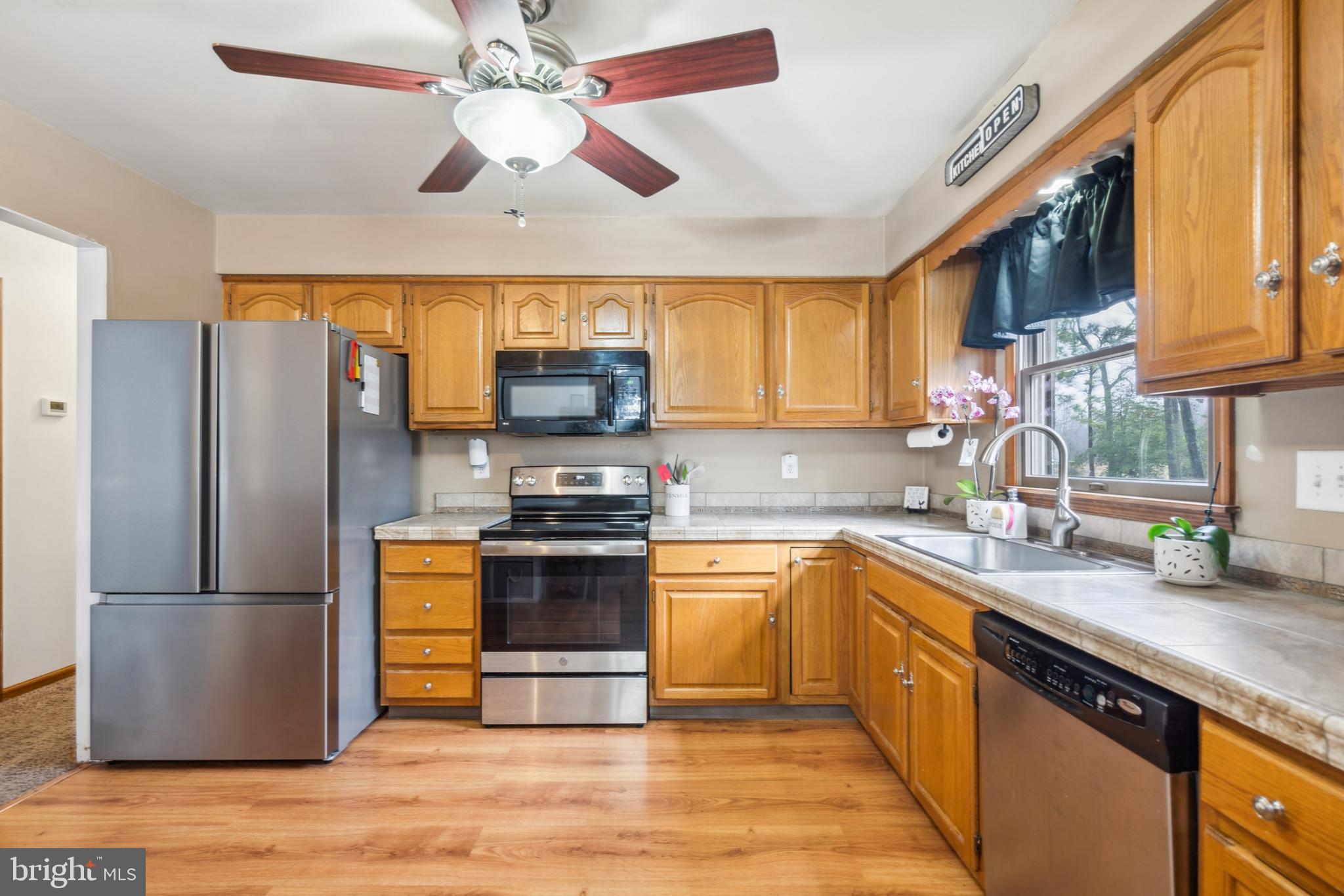 20 Holly Trail Alloway, NJ 08302 - Photo 9 of 26 a kitchen with stainless steel appliances granite countertop a refrigerator a stove top oven a sink and dishwasher