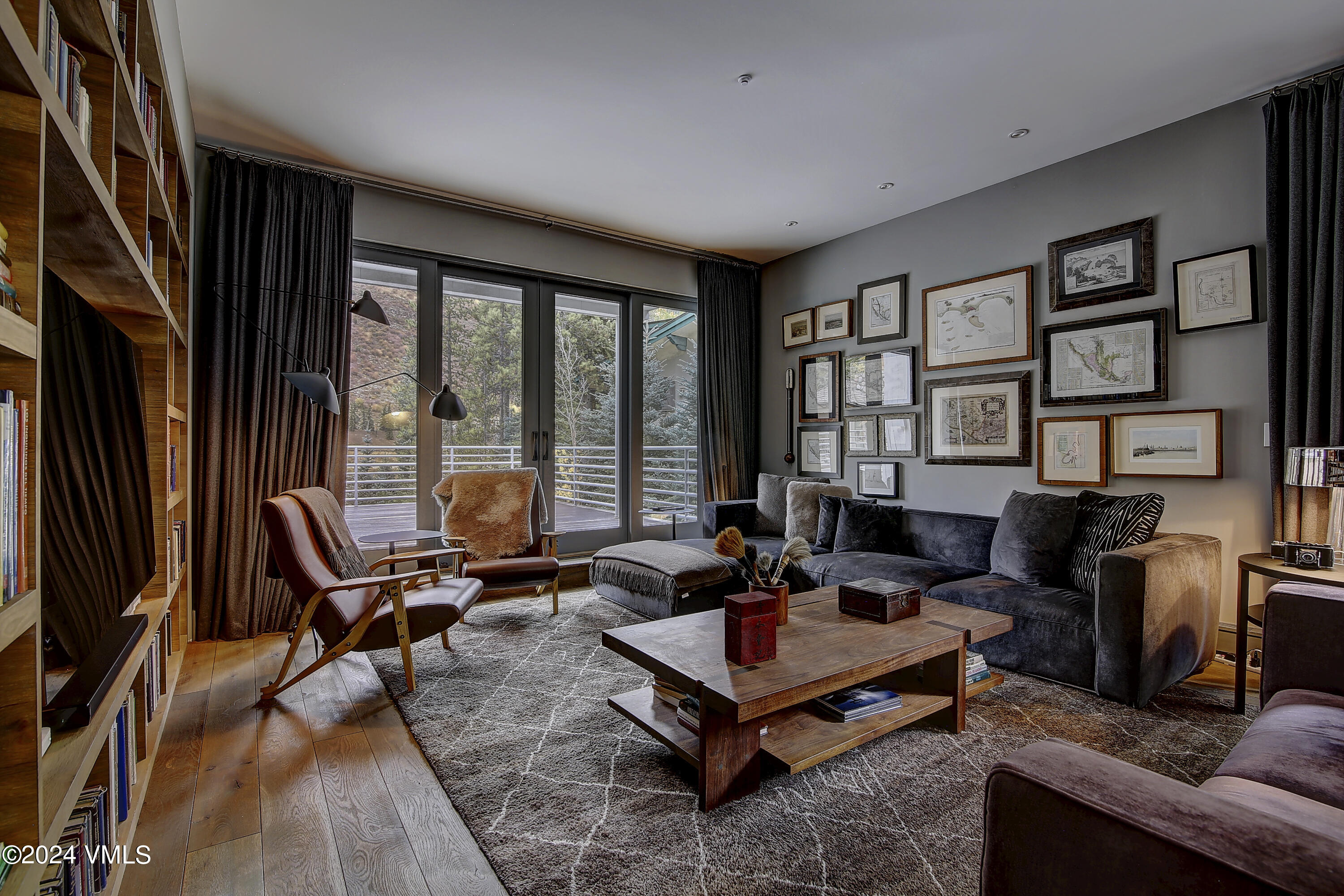 1042 Eagles Nest Circle Vail, CO 81657 - Photo 4 of 24 a living room with furniture and a floor to ceiling window