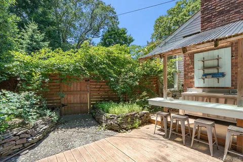 a view of a house with swimming pool and sitting area