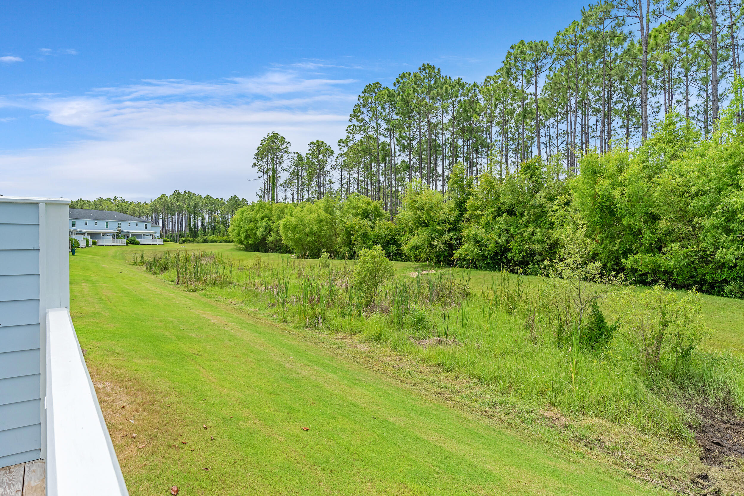 26 Golden Bell Court, Unit 26D Inlet Beach, FL 32461 - Photo 4 of 47 a view of a lake with a big yard