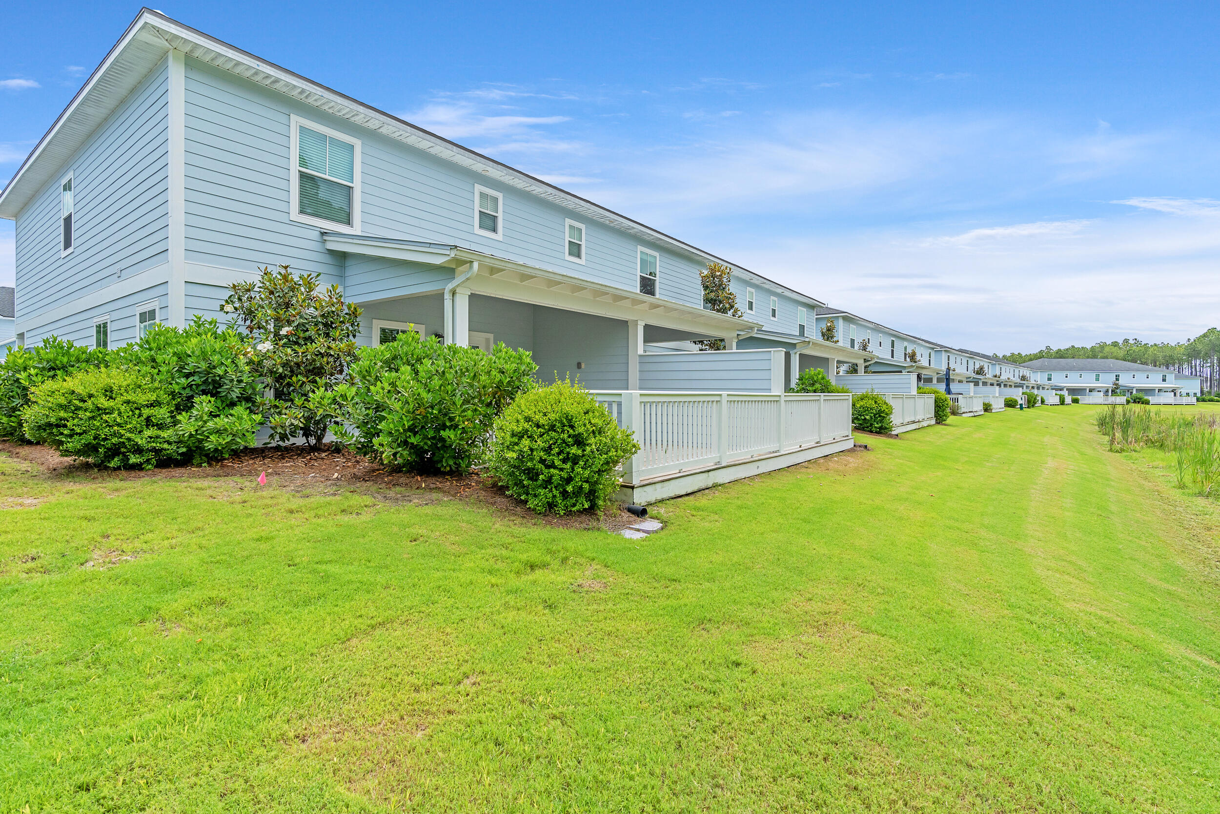 26 Golden Bell Court, Unit 26D Inlet Beach, FL 32461 - Photo 5 of 47 a view of a back yard of the house