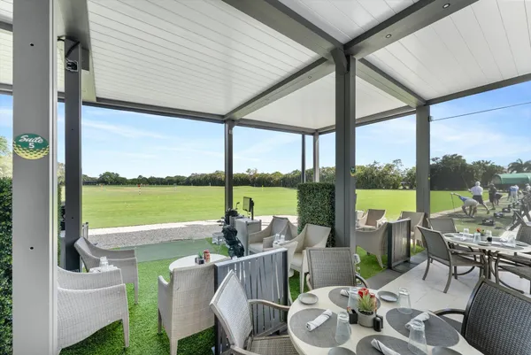 a view of swimming pool with furniture