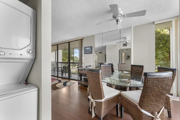 a view of a dining room with furniture window and outside view
