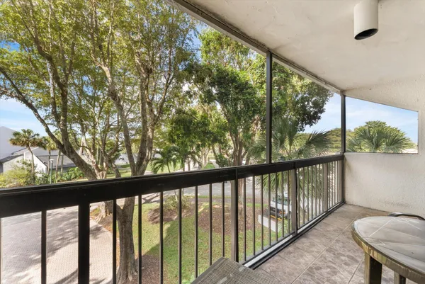 a view of a balcony with furniture