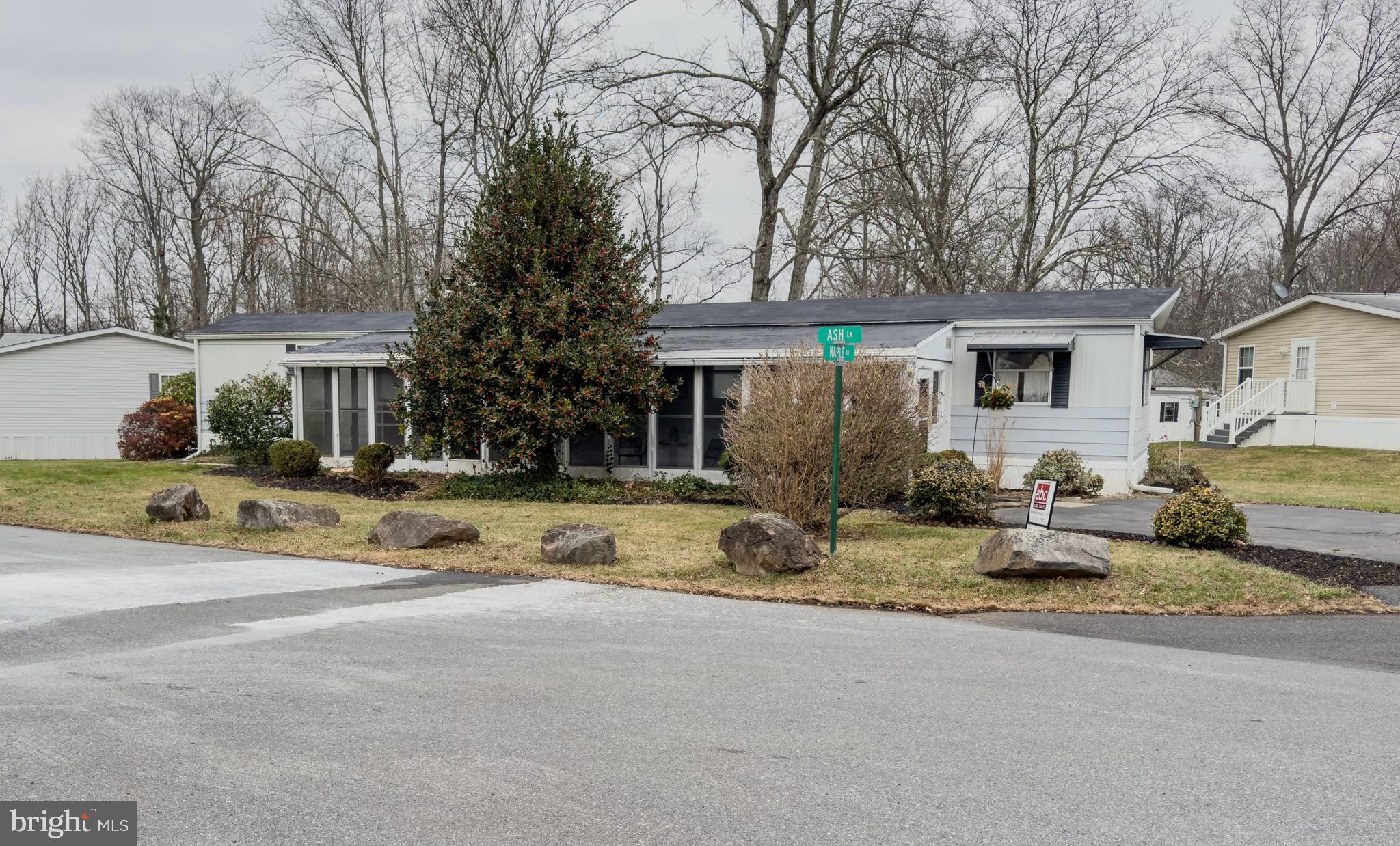 a house that has a tree in front of it