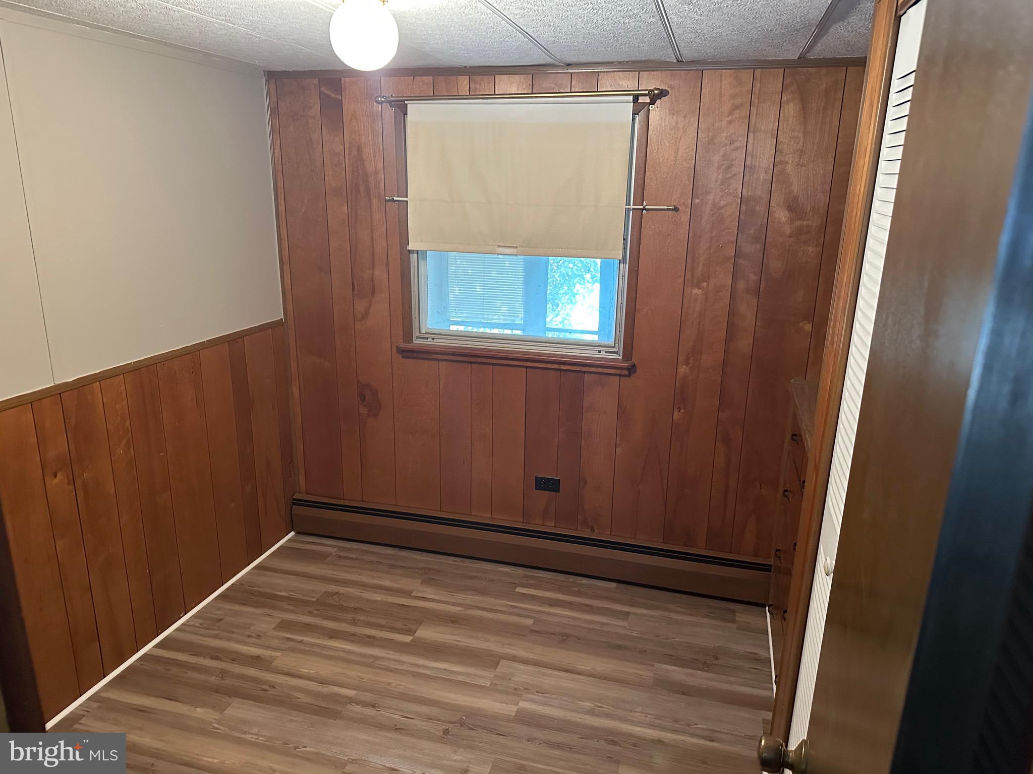 9 Maple Quakertown, PA 18951 - Photo 12 of 12 a view of an empty room with wooden floor and a window