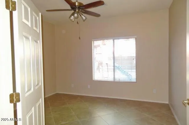 an empty room with a bathroom and a sink