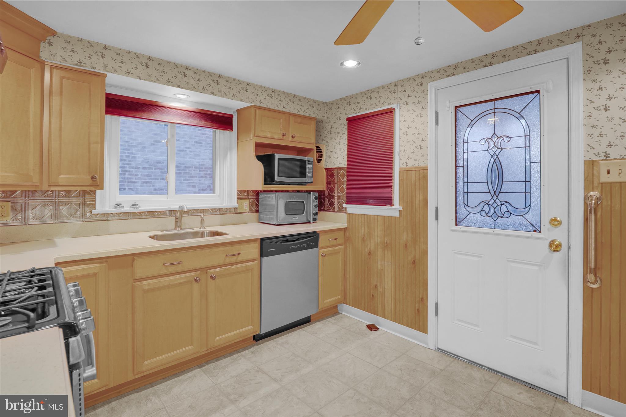 433 May Street Pottstown, PA 19464 - Photo 13 of 21 a kitchen with stainless steel appliances granite countertop a refrigerator and a sink