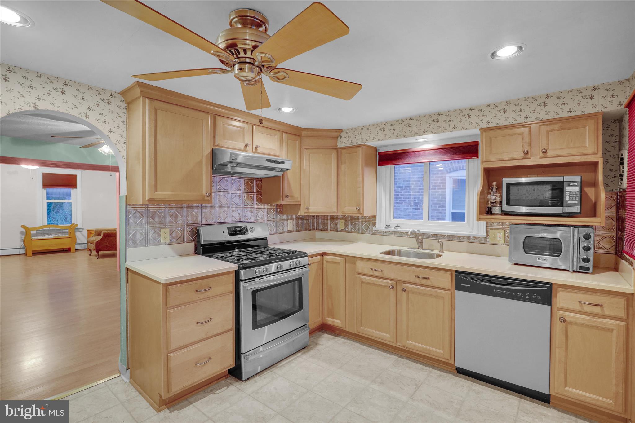 433 May Street Pottstown, PA 19464 - Photo 14 of 21 a kitchen with granite countertop a sink stainless steel appliances and cabinets