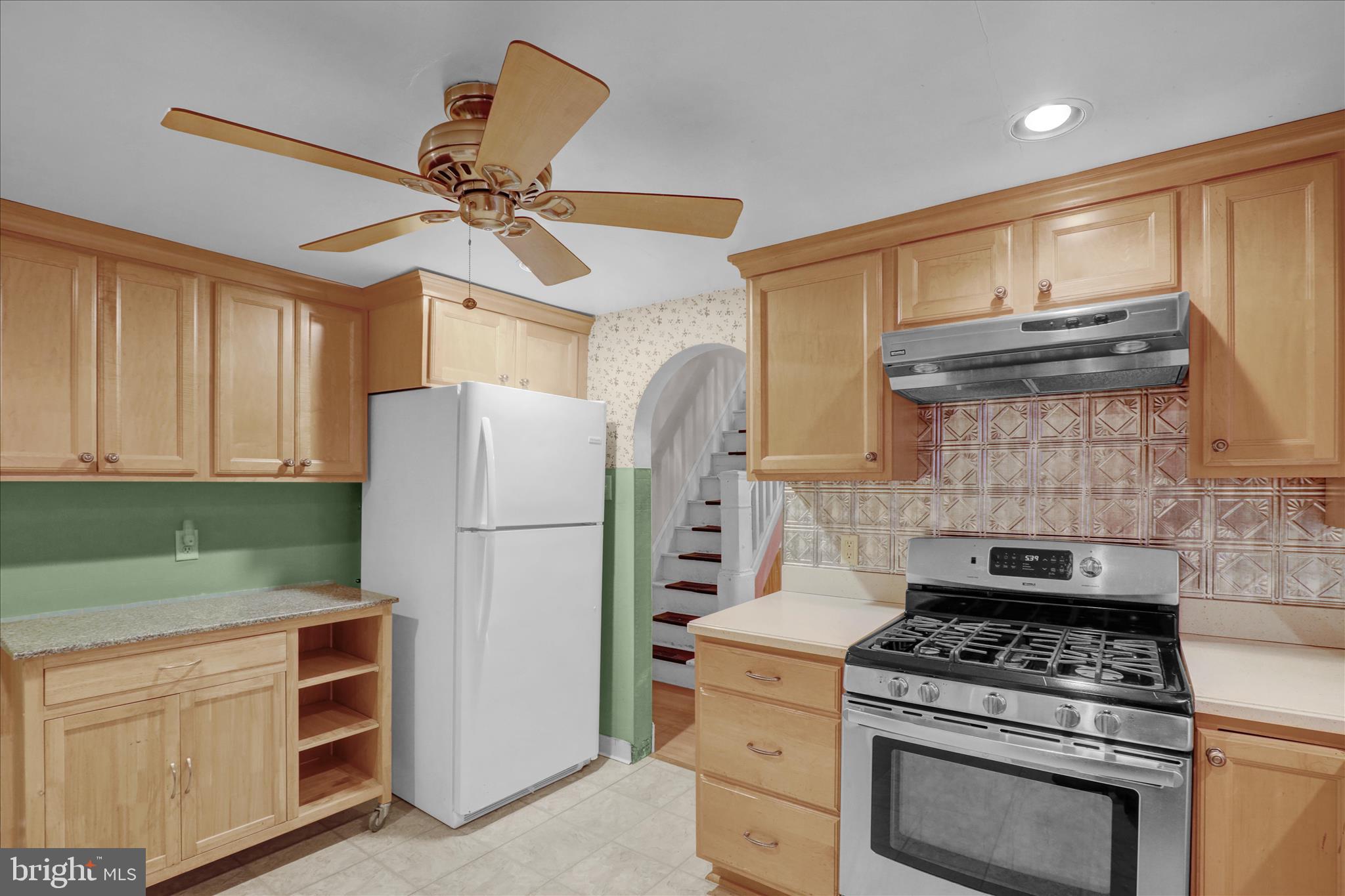 433 May Street Pottstown, PA 19464 - Photo 15 of 21 a kitchen with refrigerator cabinets and stove top oven