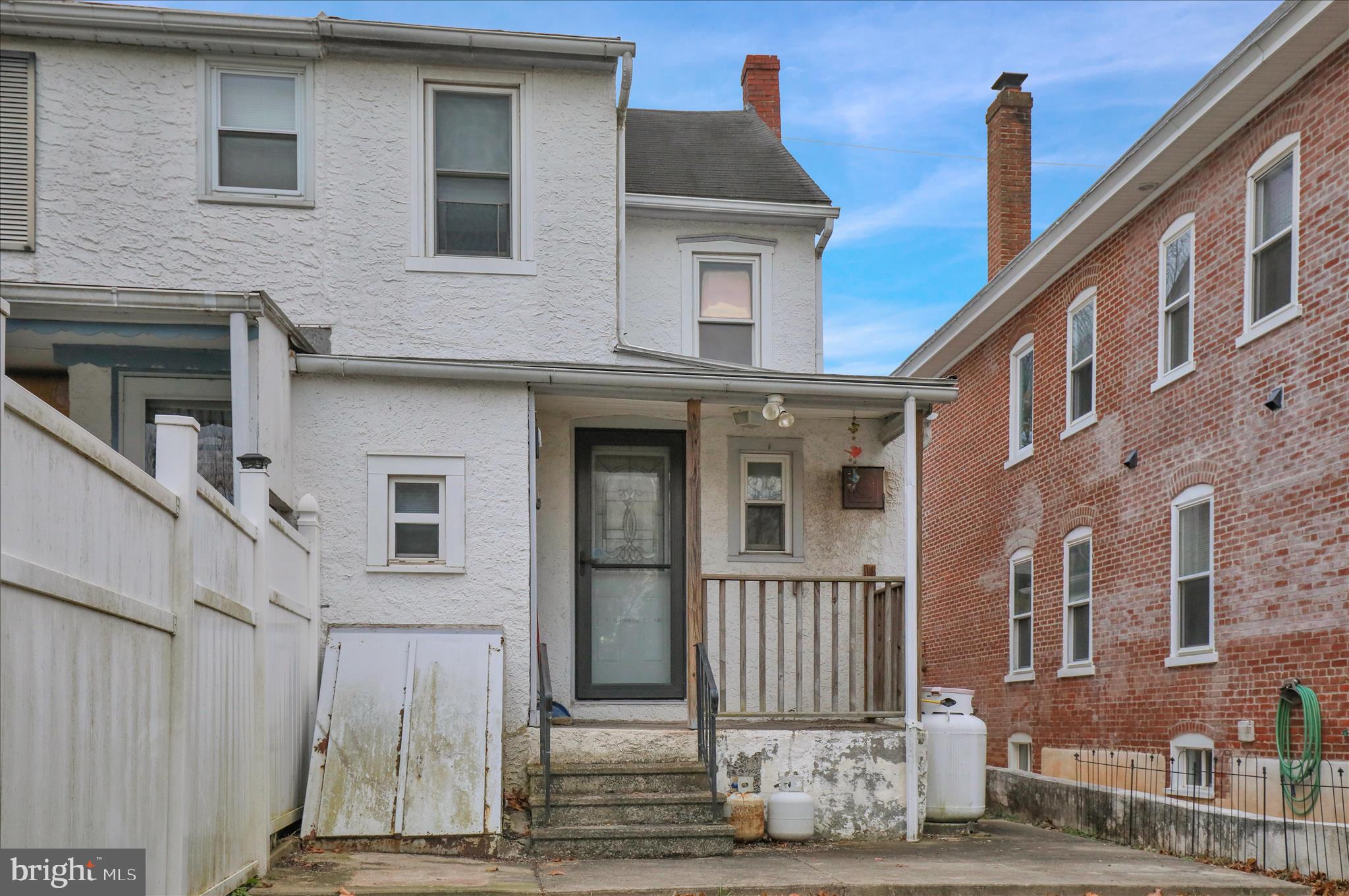 433 May Street Pottstown, PA 19464 - Photo 5 of 21 a front view of a house with a yard