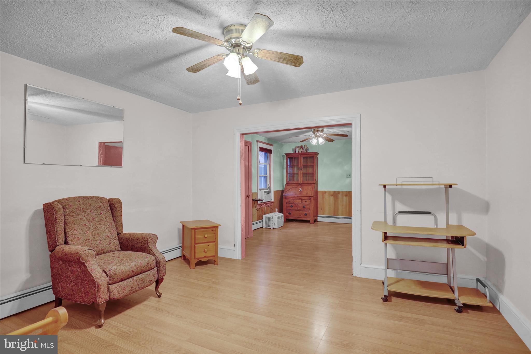 433 May Street Pottstown, PA 19464 - Photo 7 of 21 a living room with furniture and a chandelier