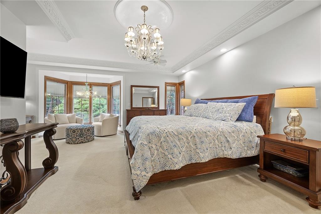 2779 Clearview Road Allison Park, PA 15101 - Photo 20 of 50 a bedroom with a bed and a chandelier