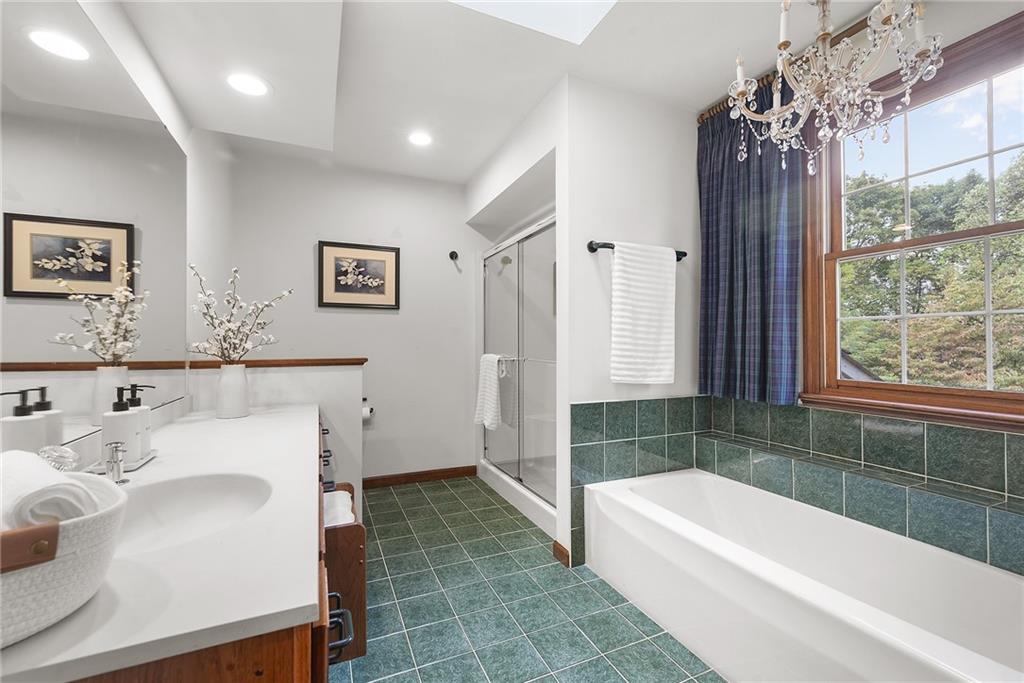 2779 Clearview Road Allison Park, PA 15101 - Photo 31 of 50 a bathroom with a sink a large mirror and a bathtub