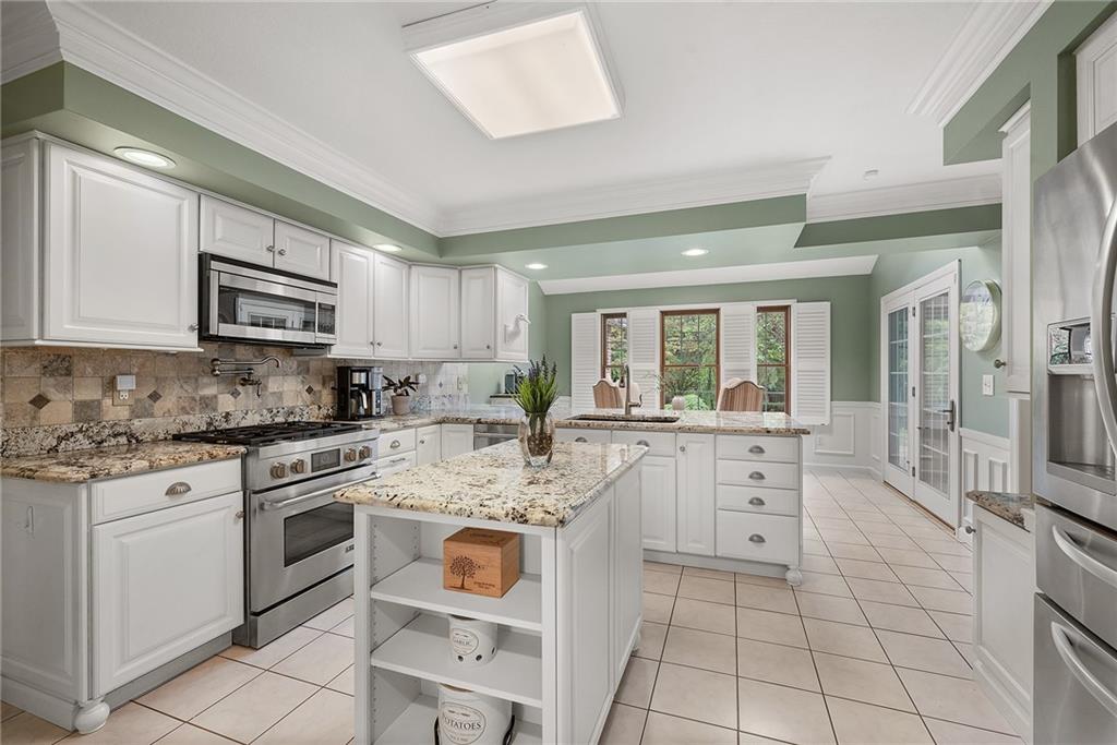 2779 Clearview Road Allison Park, PA 15101 - Photo 10 of 50 a kitchen with white cabinets appliances and sink