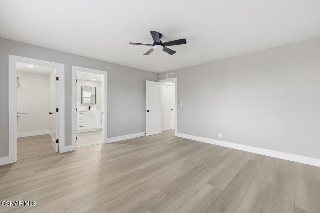 1069 Donner Avenue Simi Valley, CA 93065 - Photo 12 of 24 an empty room with wooden floor and windows