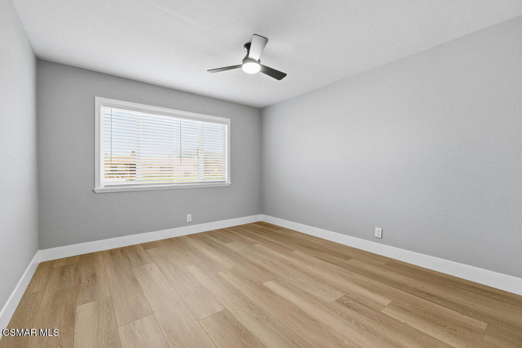 1069 Donner Avenue Simi Valley, CA 93065 - Photo 15 of 24 a view of an empty room with wooden floor and a window
