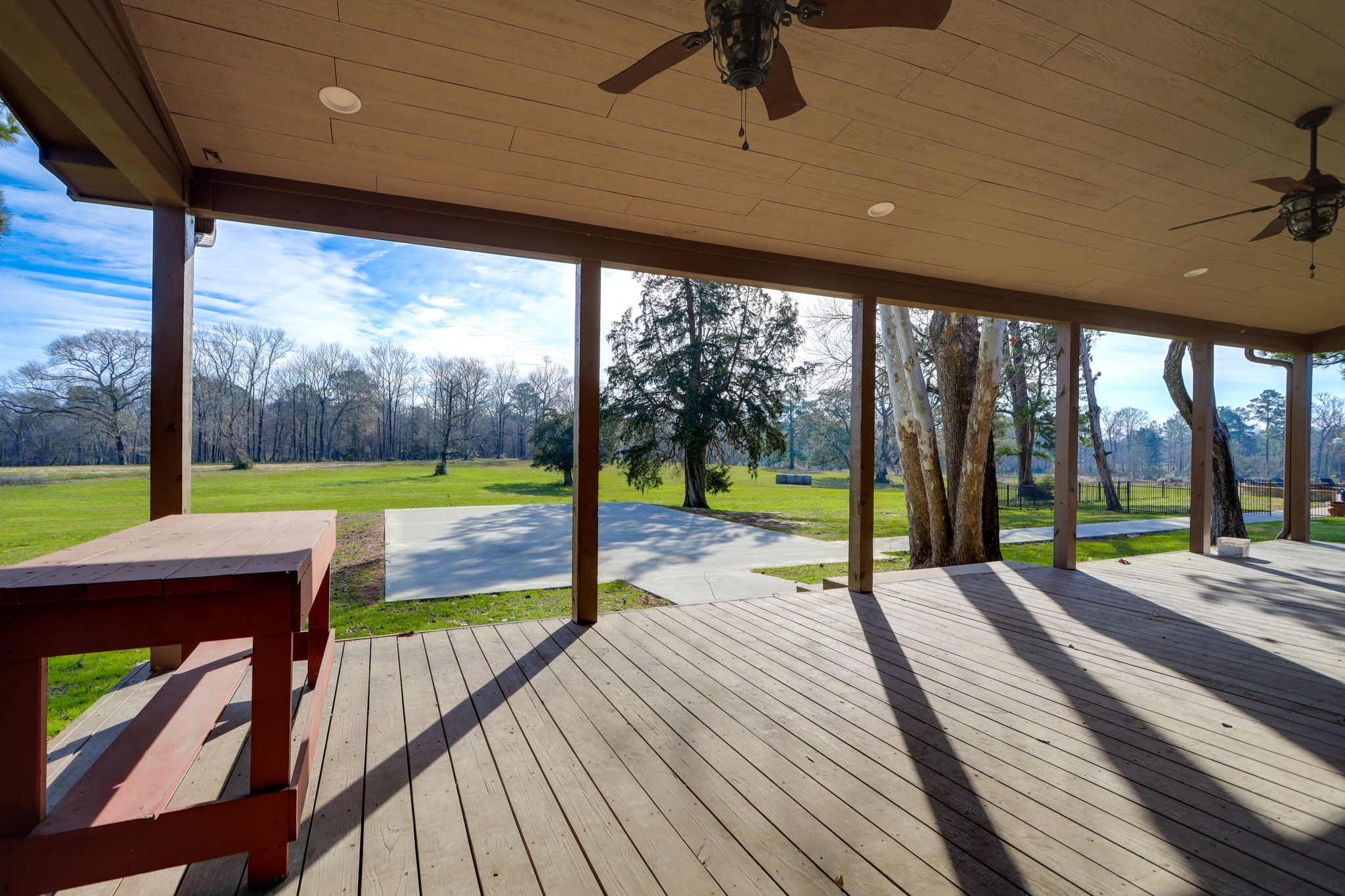 10210 Stidham Road Conroe, TX 77302 - Photo 33 of 39 a park with large trees and a wooden floor