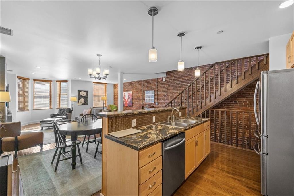 5811 Rippey Street, Unit B Pittsburgh, PA 15206 - Photo 3 of 25 a kitchen with a table and chairs