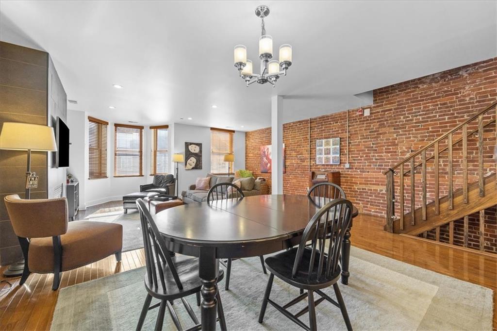 5811 Rippey Street, Unit B Pittsburgh, PA 15206 - Photo 6 of 25 a view of a dining room with furniture and chandelier