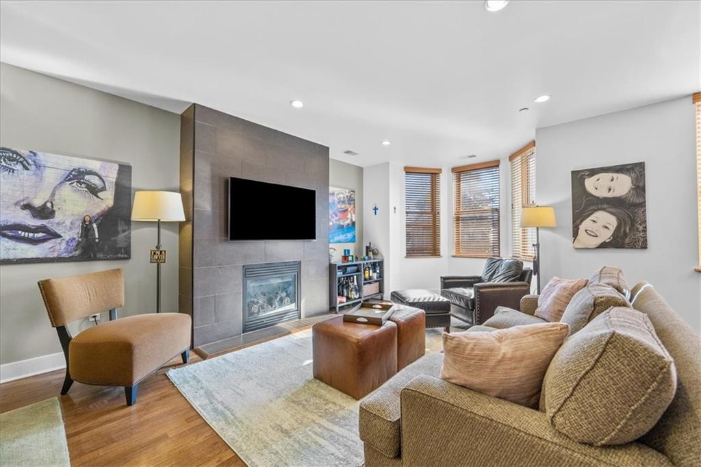 5811 Rippey Street, Unit B Pittsburgh, PA 15206 - Photo 8 of 25 a living room with fireplace furniture and a flat screen tv