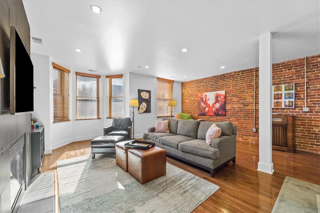 5811 Rippey Street, Unit B Pittsburgh, PA 15206 - Photo 10 of 25 a living room with furniture and a flat screen tv