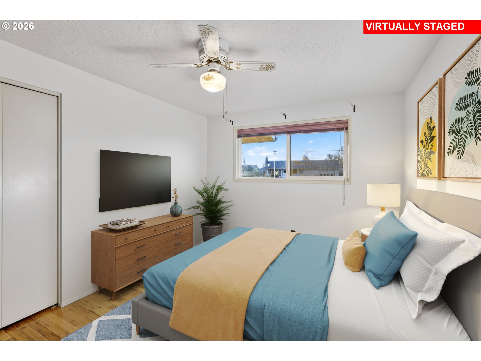 1620 Thompson Road Woodburn, OR 97071 - Photo 15 of 30 a bedroom with a bed and flat screen tv