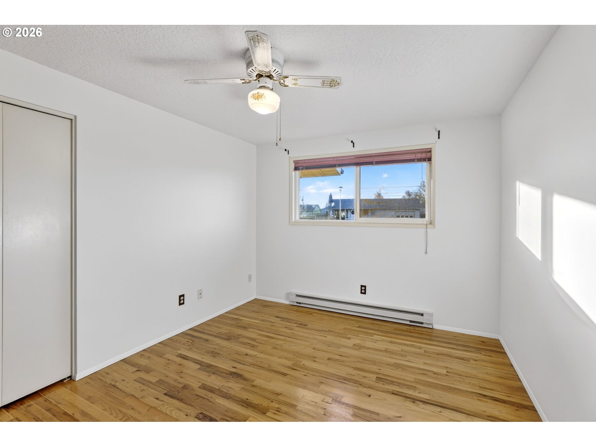 1620 Thompson Road Woodburn, OR 97071 - Photo 17 of 30 a view of empty room with wooden floor