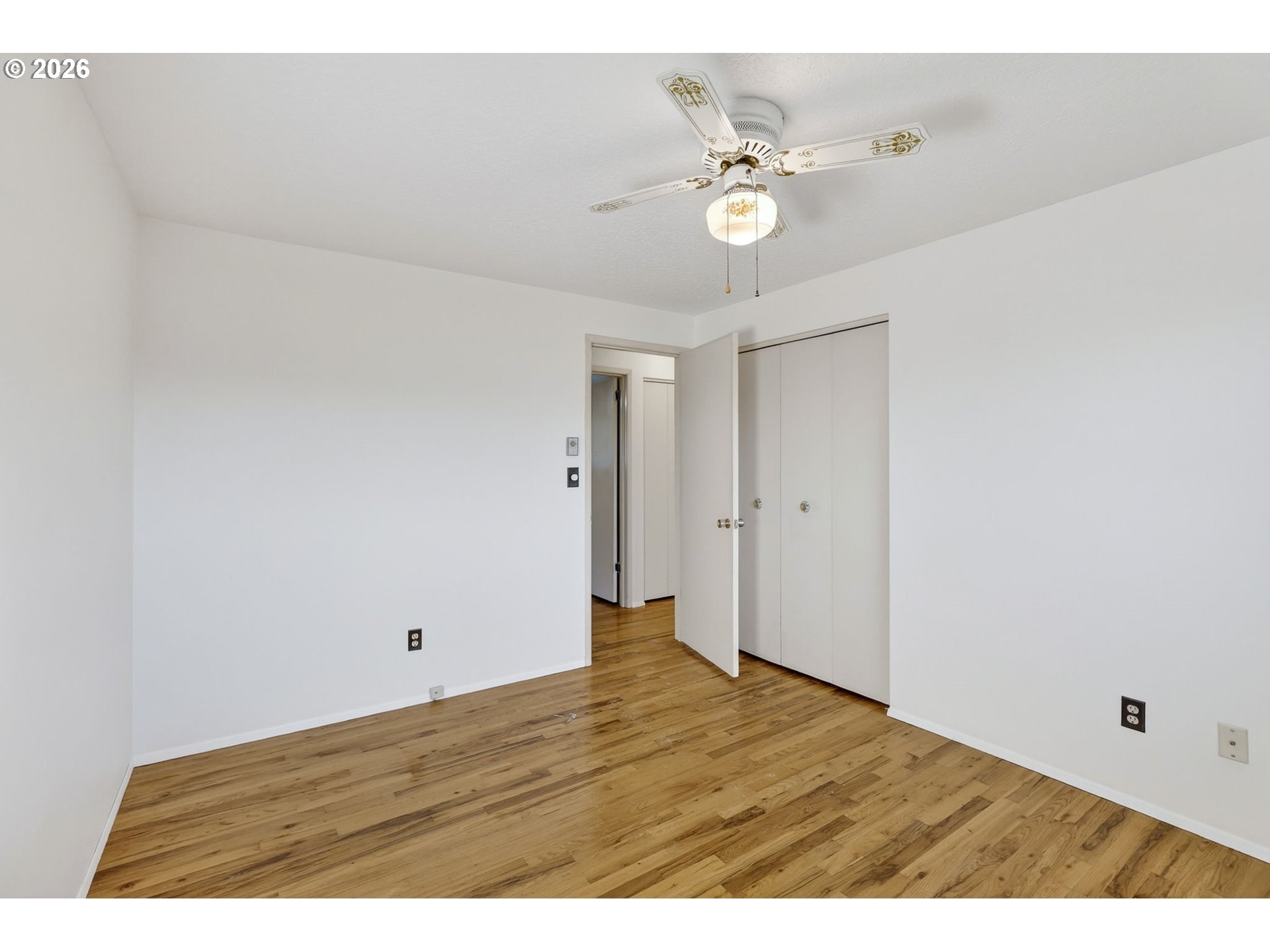 1620 Thompson Road Woodburn, OR 97071 - Photo 18 of 30 a view of an empty room with wooden floor