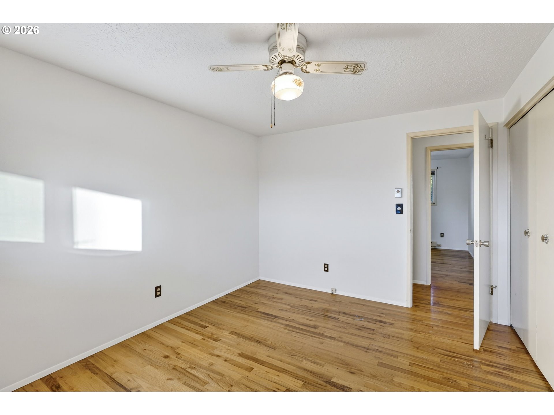 1620 Thompson Road Woodburn, OR 97071 - Photo 19 of 30 a view of an empty room with wooden floor