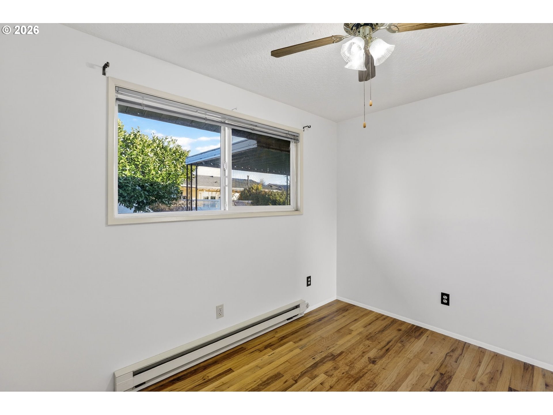 1620 Thompson Road Woodburn, OR 97071 - Photo 21 of 30 a view of empty room with window and fan