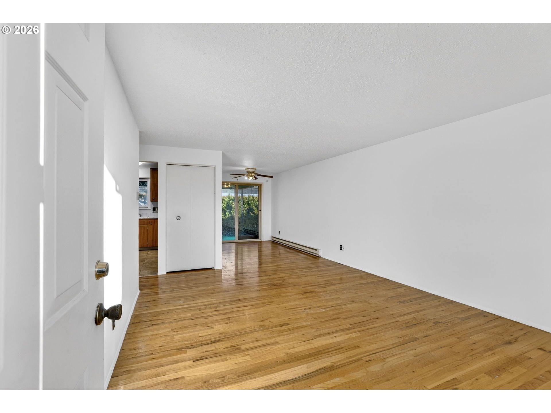 1620 Thompson Road Woodburn, OR 97071 - Photo 5 of 30 a view of an empty room with closet and windows