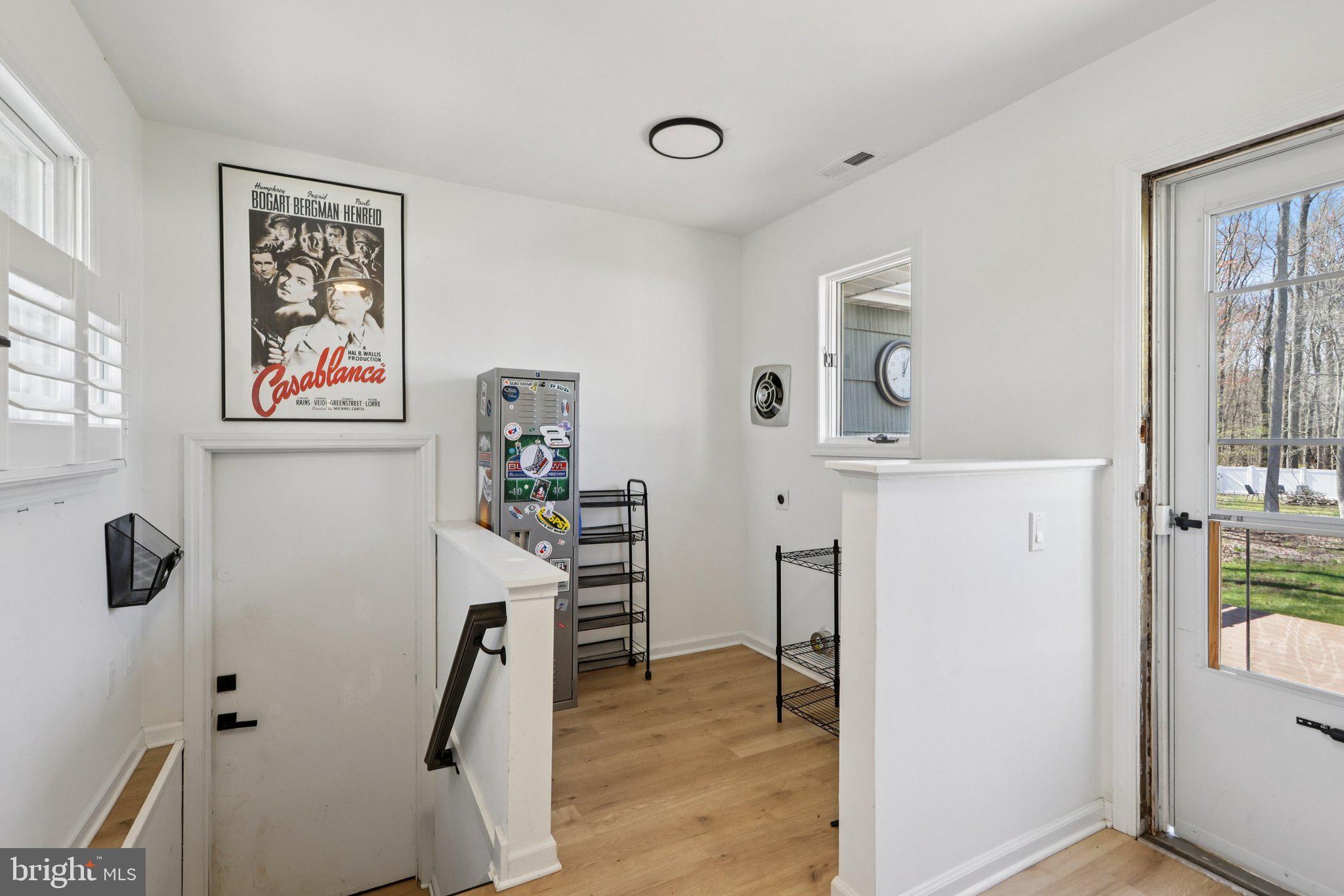 351 Merrick Road Robbinsville, NJ 08691 - Photo 32 of 69 a view of a workspace with furniture and wooden floor