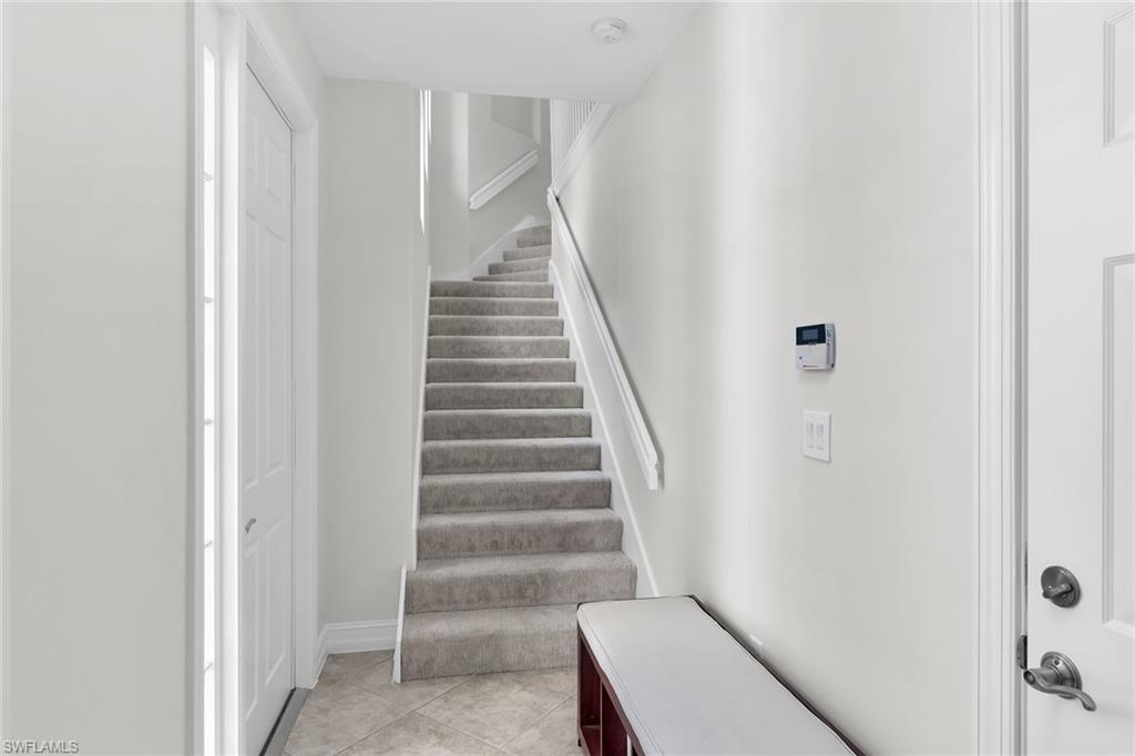 1286 Rialto Way, Unit 9202 Naples, FL 34114 - Photo 30 of 49 Staircase leading to living area.