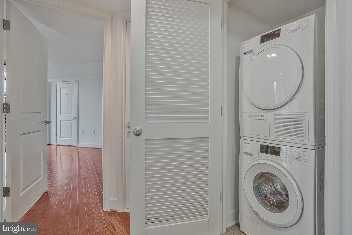 11800 Sunset Hills Road, Unit 514 Reston, VA 20190 - Photo 54 of 57 a view of a hallway with washer and dryer