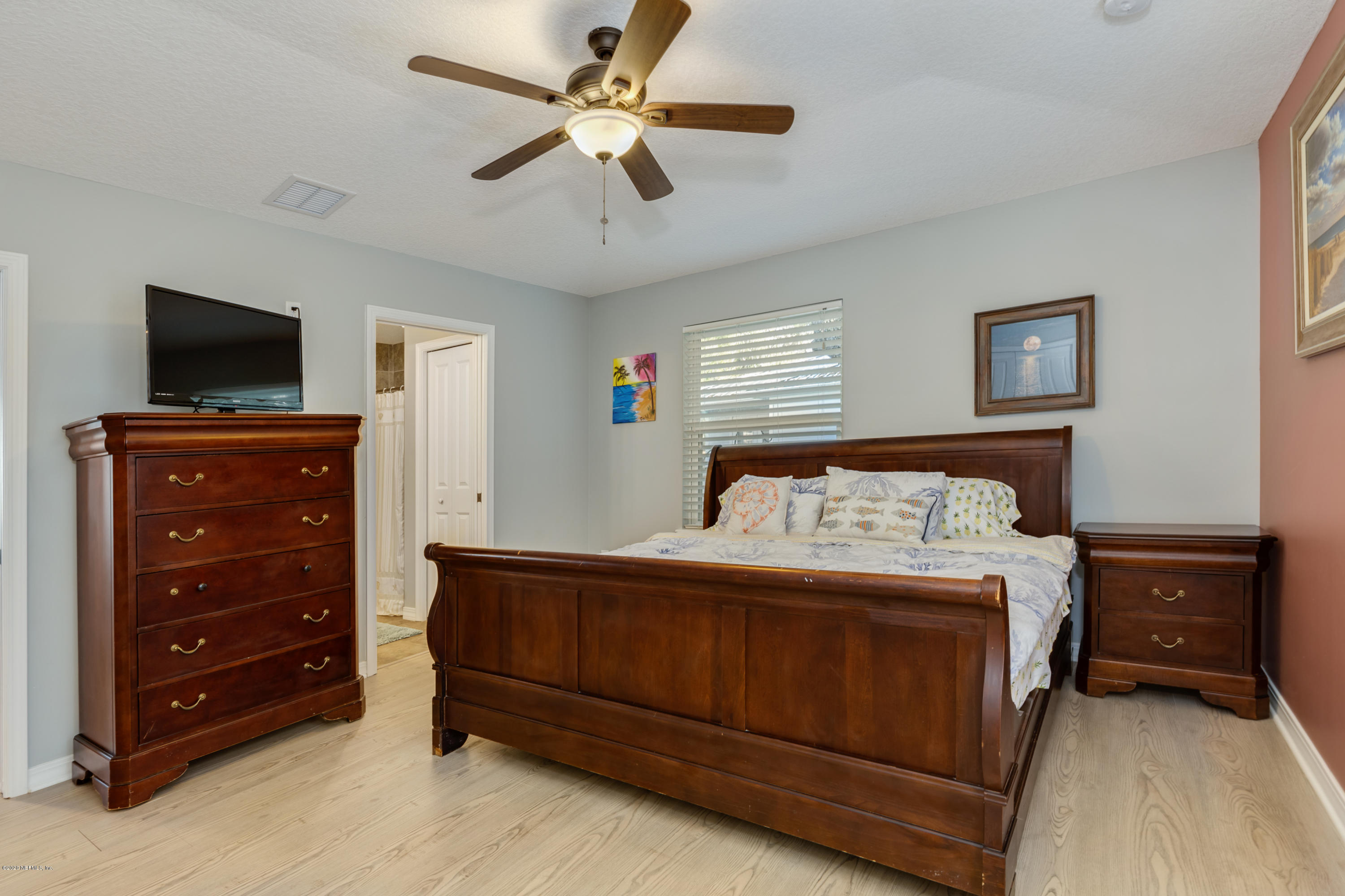 405 2nd Street St. Augustine, FL 32084 - Photo 13 of 32 a bedroom with a bed and a television