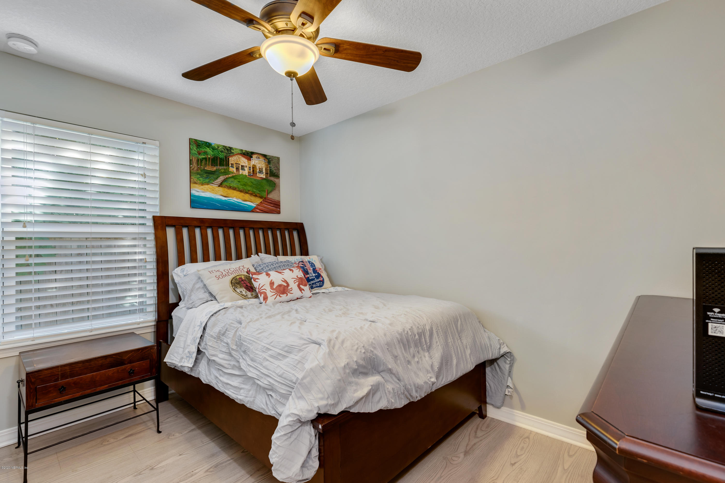 405 2nd Street St. Augustine, FL 32084 - Photo 15 of 32 a bedroom with a bed and a desk