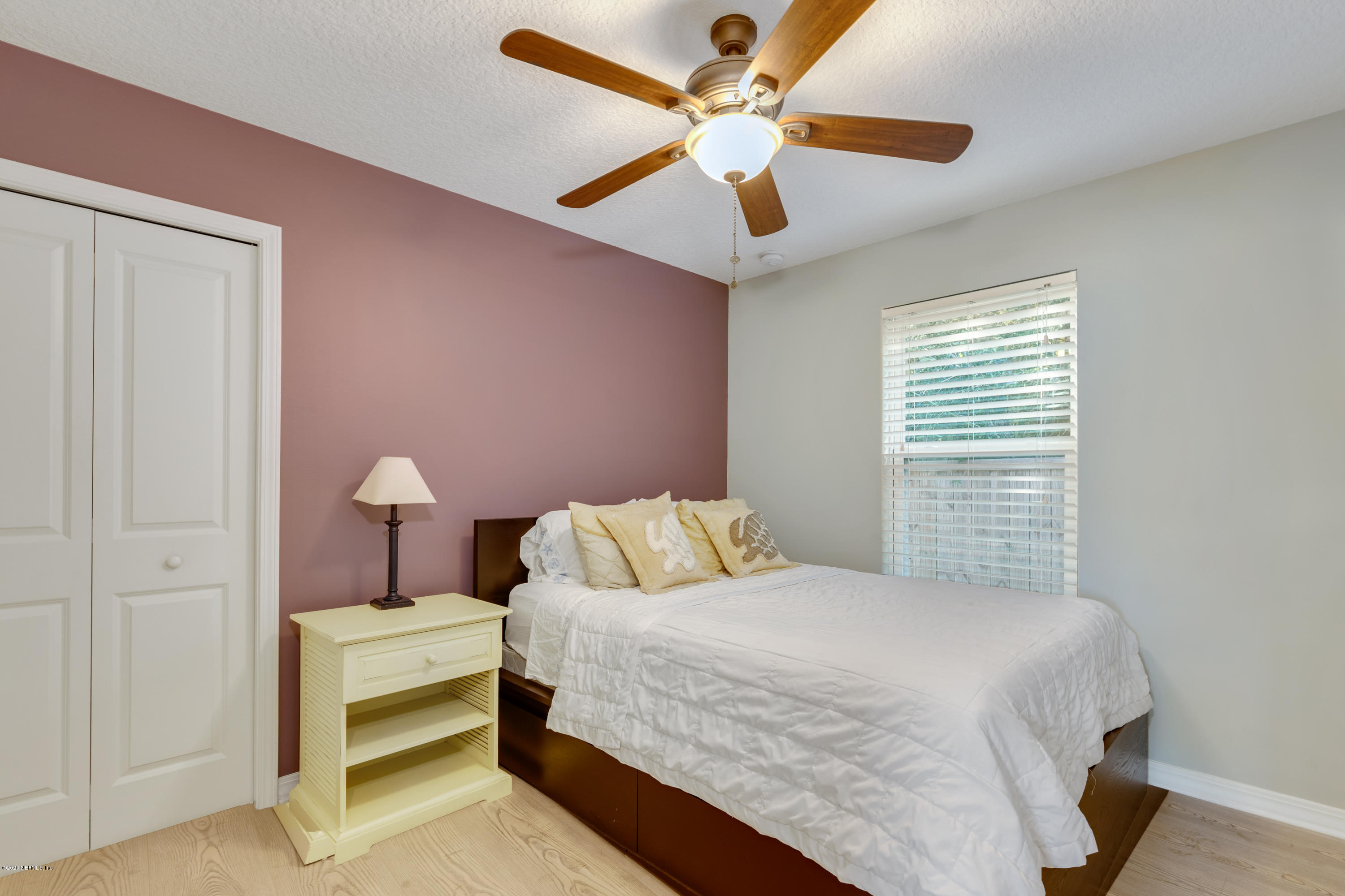 405 2nd Street St. Augustine, FL 32084 - Photo 17 of 32 a bedroom with a bed and a ceiling fan