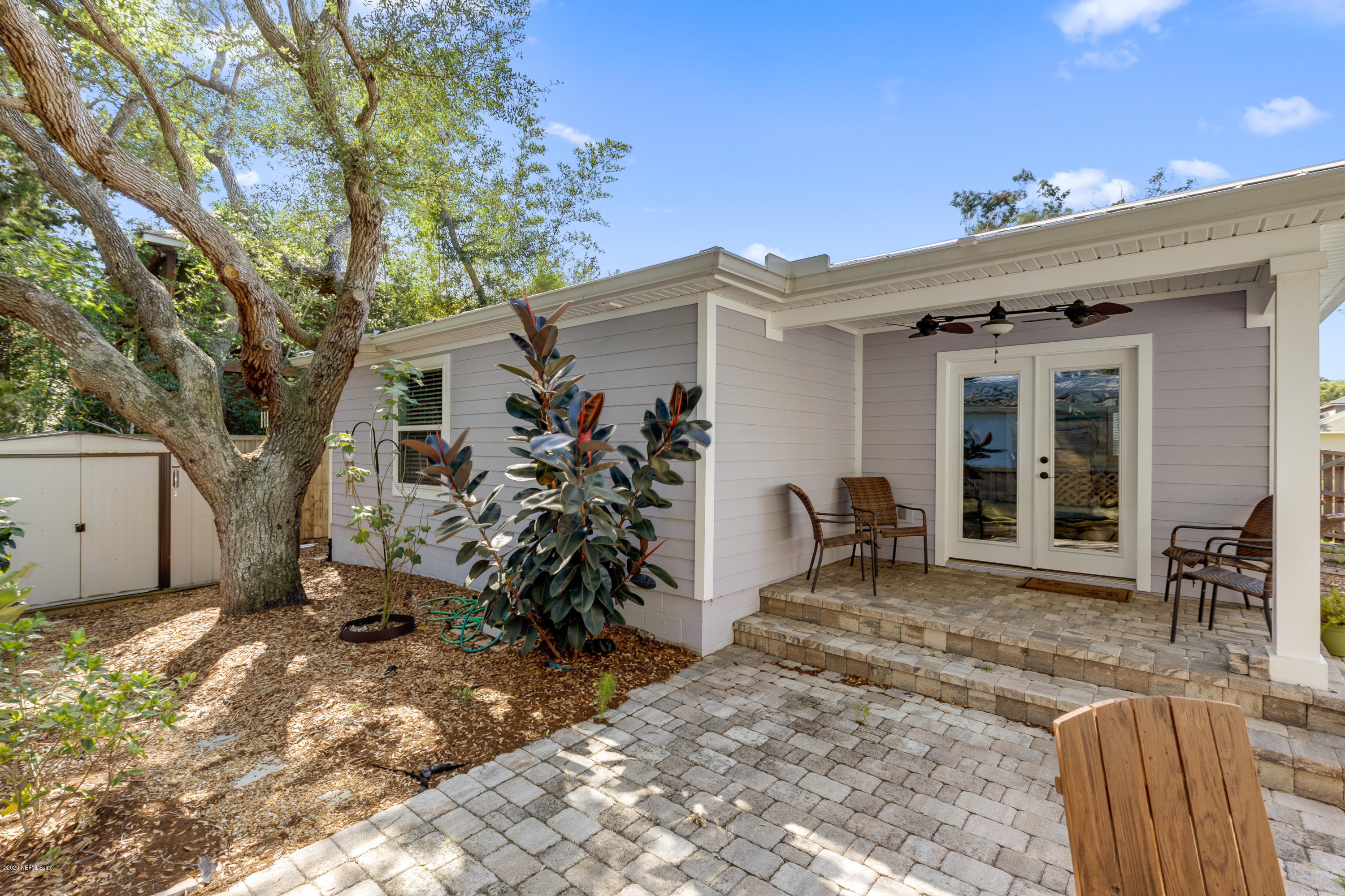 405 2nd Street St. Augustine, FL 32084 - Photo 22 of 32 a backyard of a house with seating space