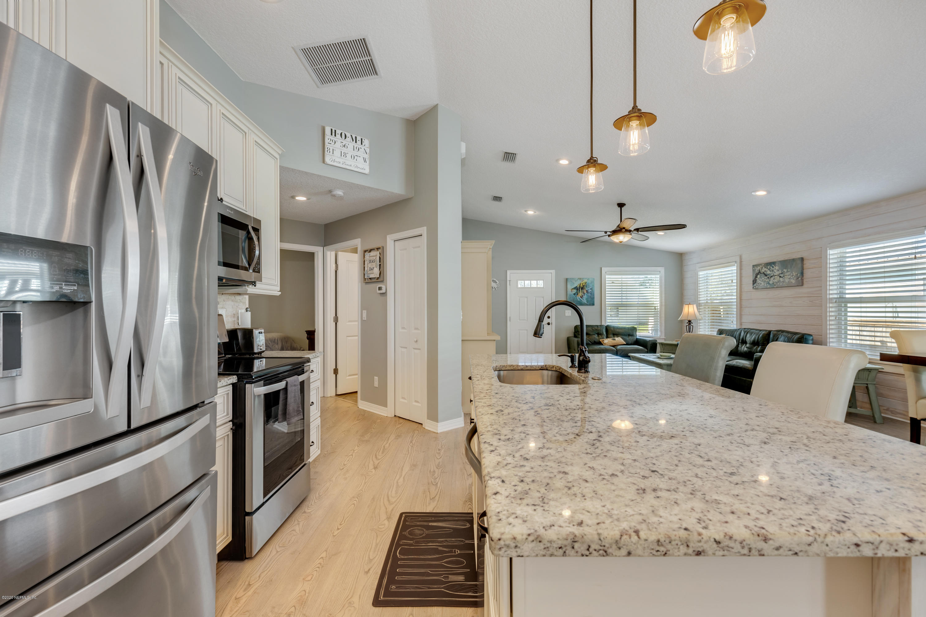405 2nd Street St. Augustine, FL 32084 - Photo 10 of 32 a large kitchen with stainless steel appliances granite countertop a stove refrigerator and cabinets
