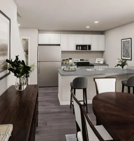 a bedroom with a bed table flowerpot and window