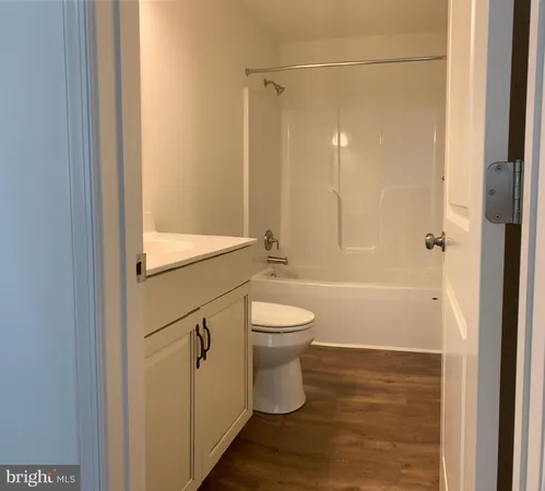 a kitchen with stainless steel appliances a stove top oven a sink and a refrigerator
