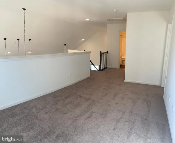 a kitchen with stainless steel appliances granite countertop a sink a stove and a wooden floors