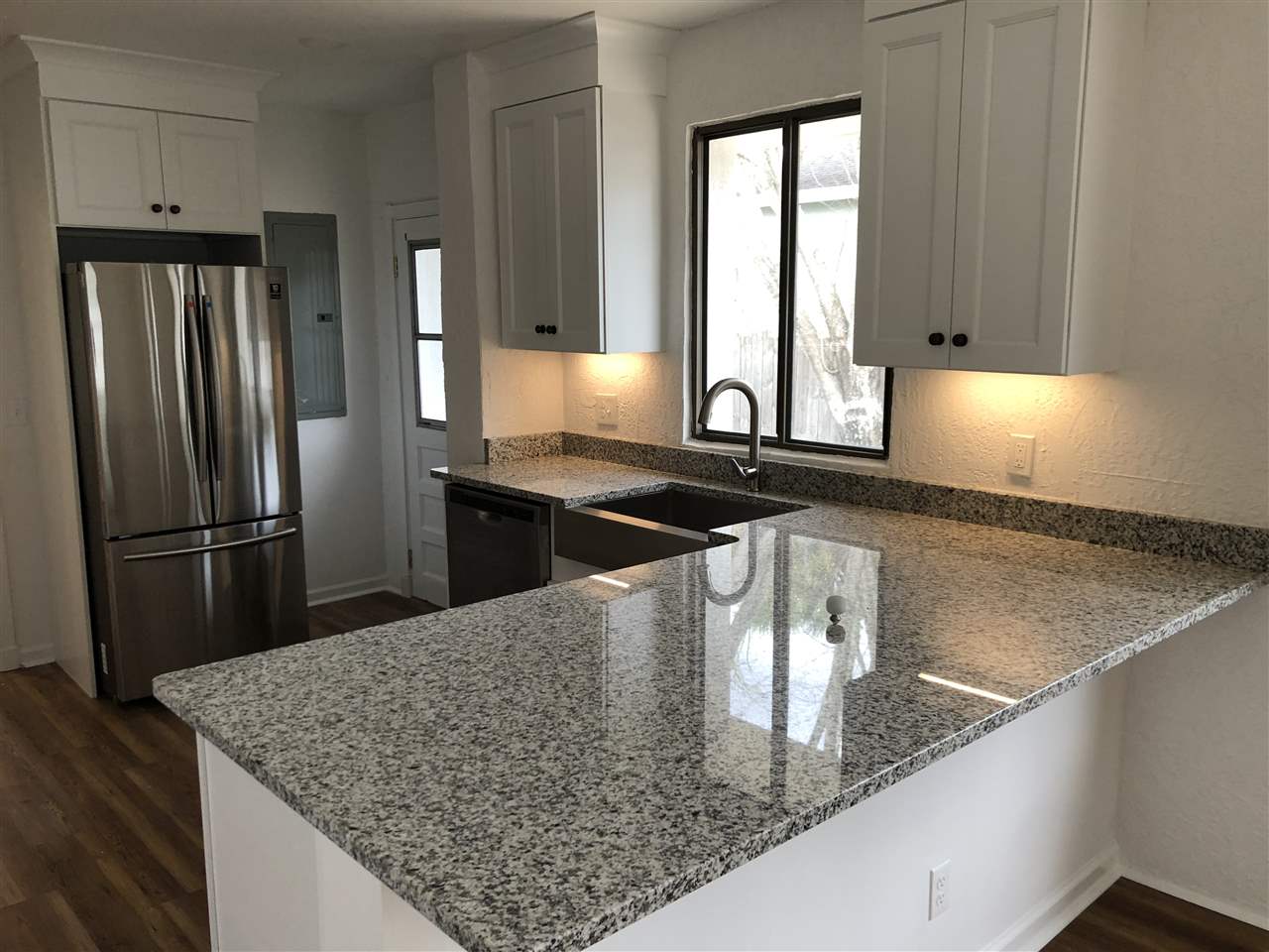 170 Twine Street St. Augustine, FL 32084 - Photo 14 of 24 a kitchen with stainless steel appliances granite countertop a sink a stove and a refrigerator