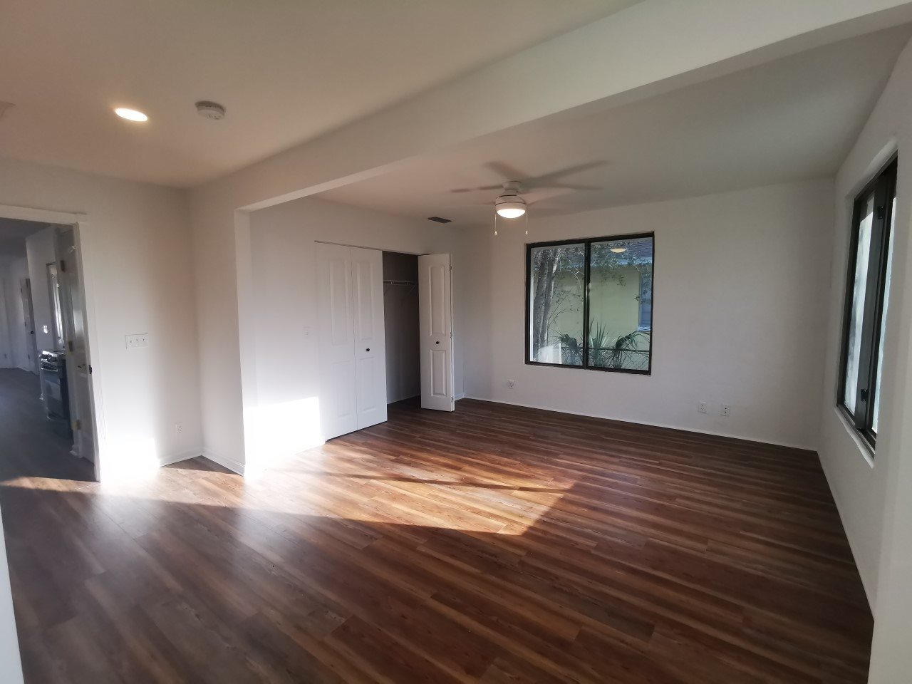 170 Twine Street St. Augustine, FL 32084 - Photo 17 of 24 a view of an empty room with wooden floor and a window