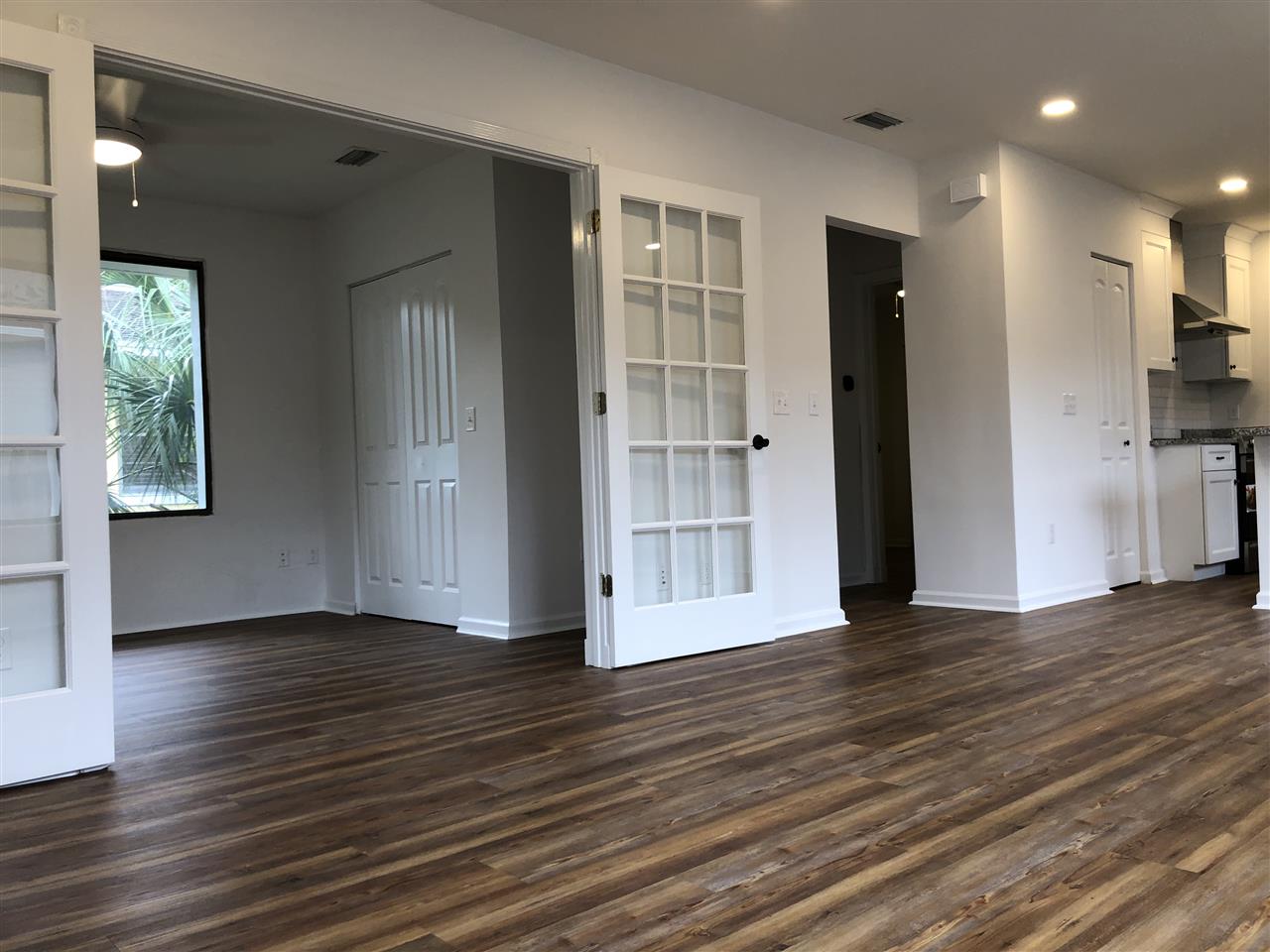 170 Twine Street St. Augustine, FL 32084 - Photo 7 of 24 a view of an empty room with wooden floor and a window